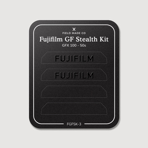 Stealth Kit for Fujifilm GFX 100 and 50S: Ghost Logo and Plain Black vinyl labels on the Field Made Co backing sheet