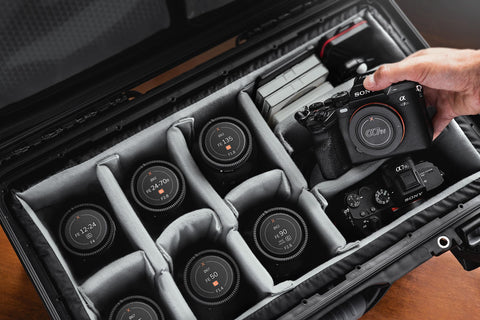 Sony lenses and camera in a protective case with compartments for lenses